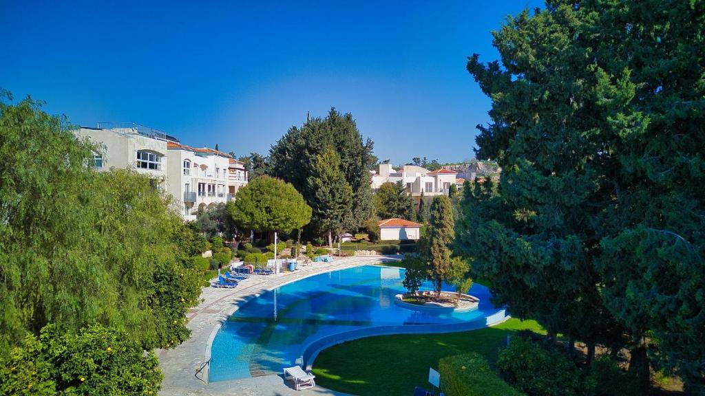 an overhead view of a swimming pool in a resort at Hesperides Gardens 1 BED in Paphos