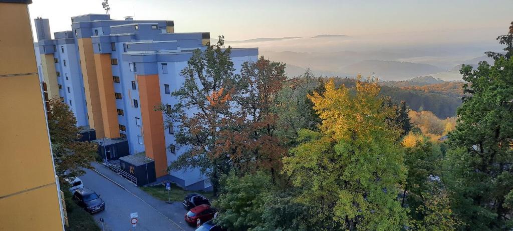 an aerial view of a building with trees and a road at Ferienwohnungen Adri im Ferienpark Geyersberg in Freyung