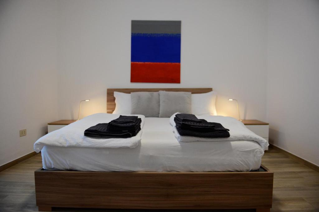 Ένα ή περισσότερα κρεβάτια σε δωμάτιο στο Residenza MM
