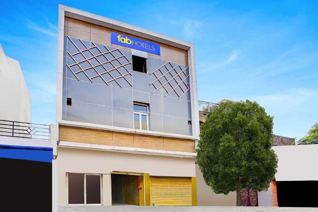 a building with a go hotels sign on it at FabHotel Ratraksh in Kānpur