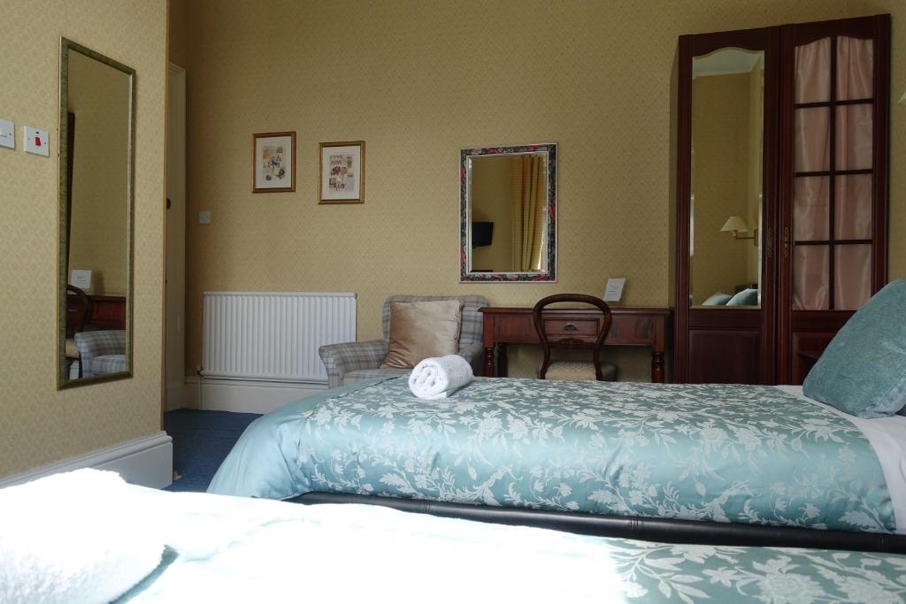 Postel nebo postele na pokoji v ubytování Ashgrove House