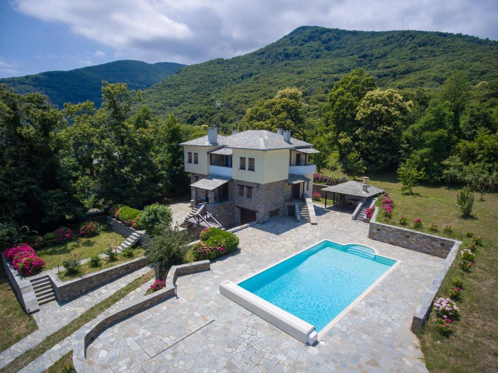 an aerial view of a house with a swimming pool at Villa Maria Amalia in Tsagarada