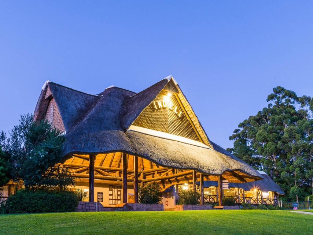 a building with a roof with a star on it at ANEW Resort Ingeli Forest Kokstad in Kokstad