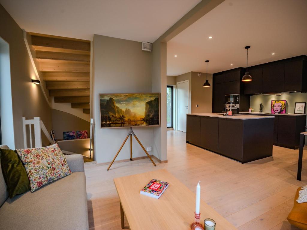 a living room with a couch and a table at Central apartment in Tromsø