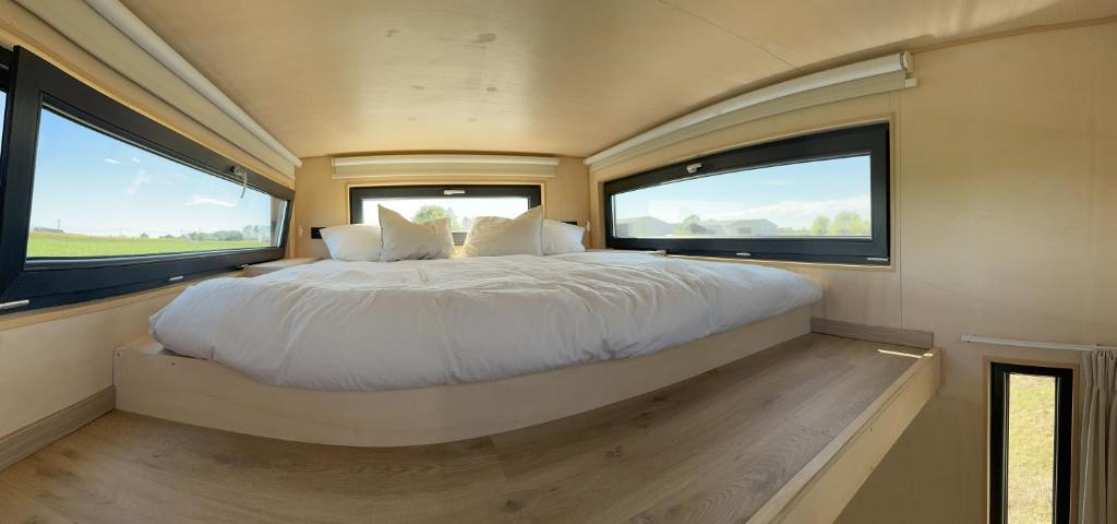 Postel nebo postele na pokoji v ubytování Tiny House du Gad Bourgeois