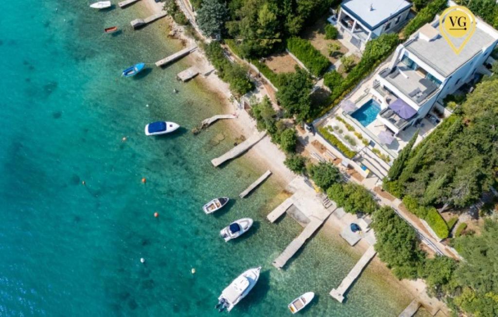 an aerial view of a harbor with boats in the water at Villa Palazzo Emanuel by Villas Guide in Jadranovo