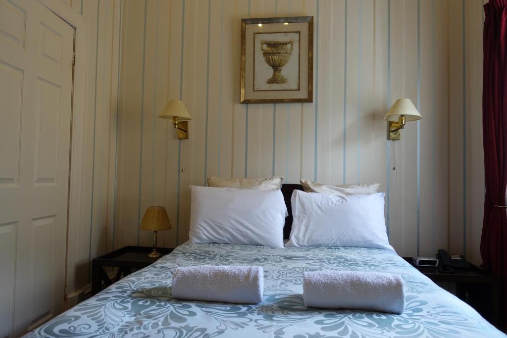 Postel nebo postele na pokoji v ubytování Ashgrove House