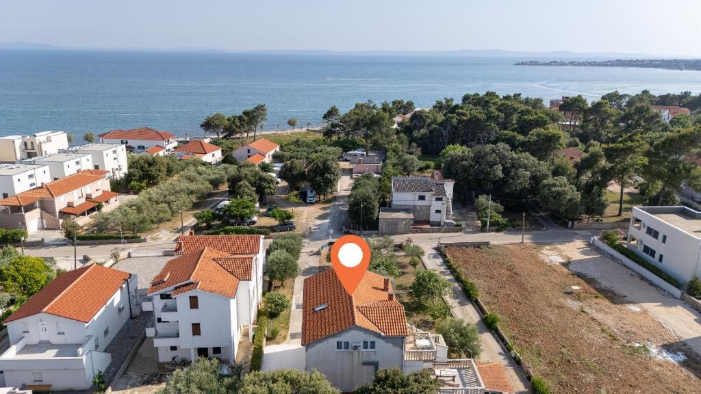 an aerial view of a town with houses and the ocean at Apartments Darko in Vir