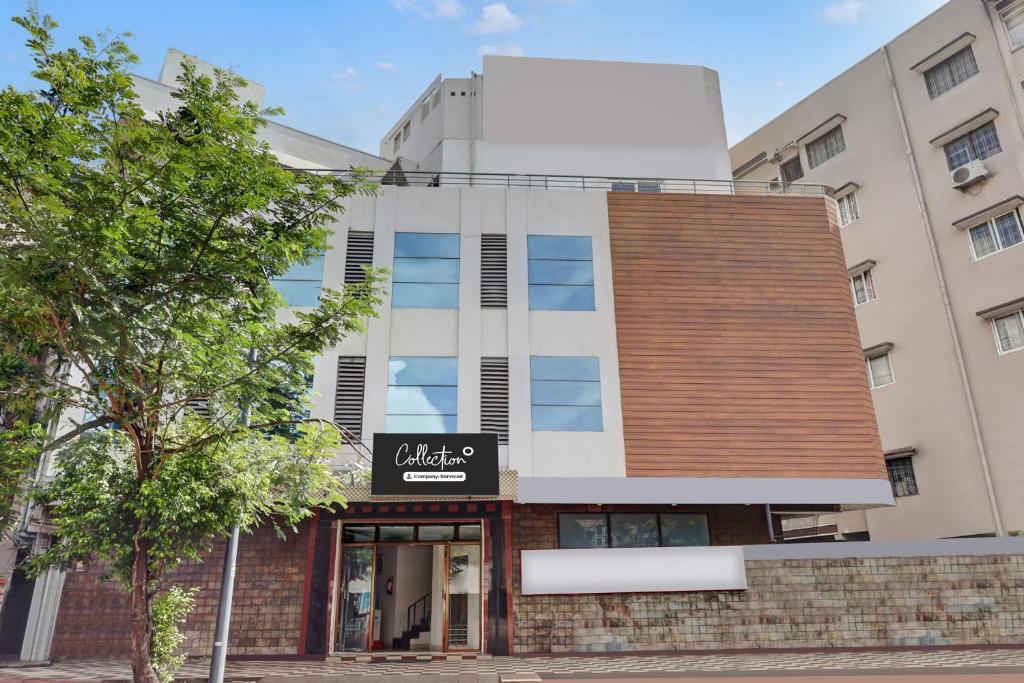 a building with a sign in front of it at Super Collection O jagadamba Junction near Beach Road in Visakhapatnam