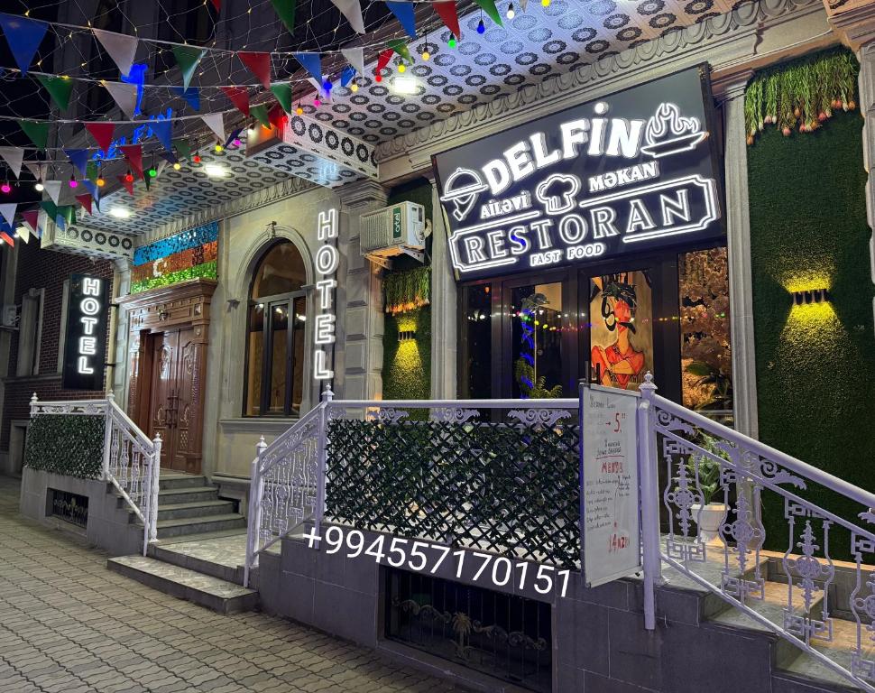 a store with a sign on the front of a building at Delfin Hotel & Restaurants & Spa in Ganja