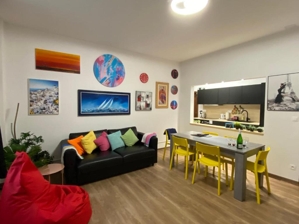 a living room with a couch and a table at Art Design Gallery - Bratislava city center in Bratislava