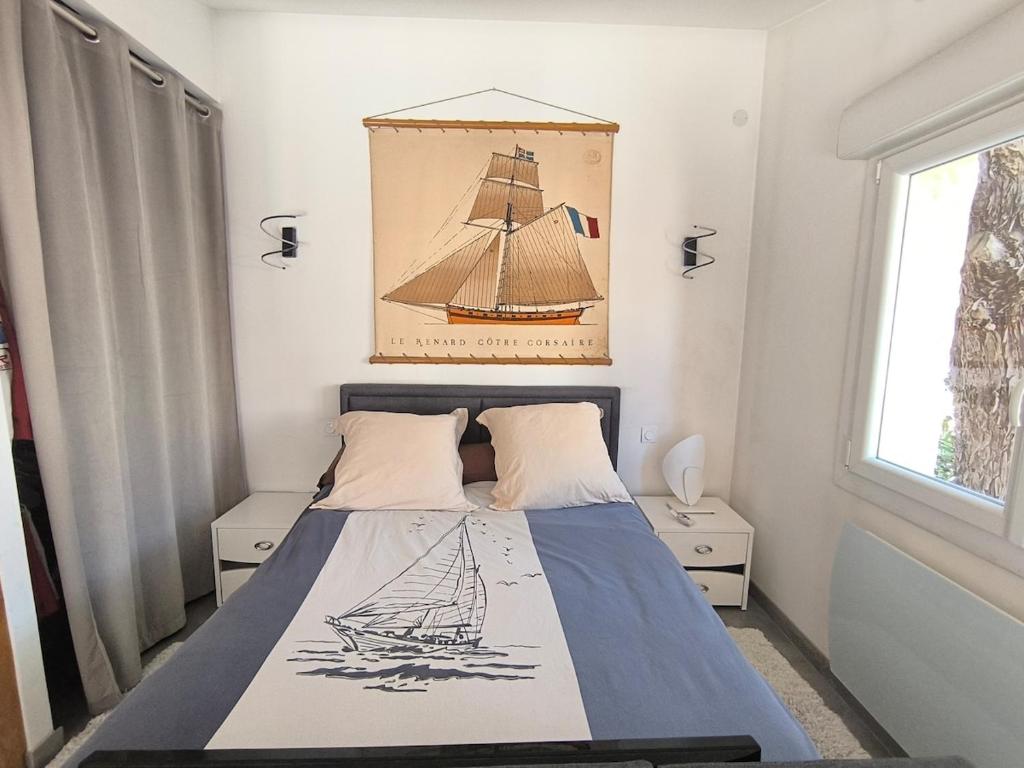 a bedroom with a bed with a drawing of a ship at Charming house Aix Marseille with outdoor area in Bouc-Bel-Air