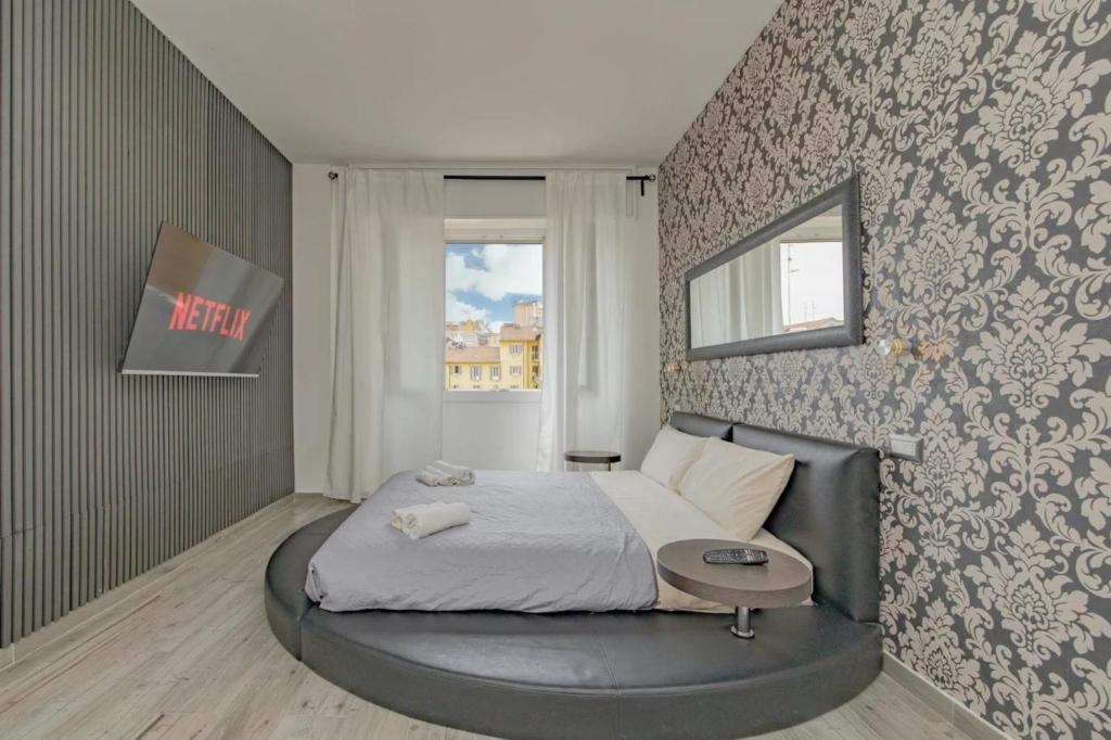 a bedroom with a bed with a round bed frame at Round Room - 7 in Milan