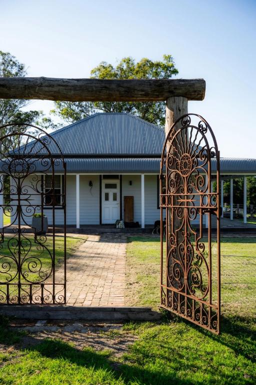 an iron gate in front of a house at Ravenscroft Cottage in Eccleston