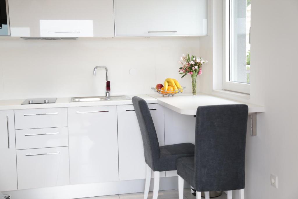 Kuchyň nebo kuchyňský kout v ubytování Apartment Nada