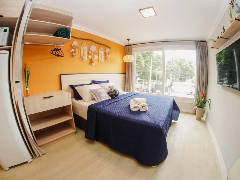 Katil atau katil-katil dalam bilik di Studio de 2 Quartos com Ar condicionado 4 pessoas