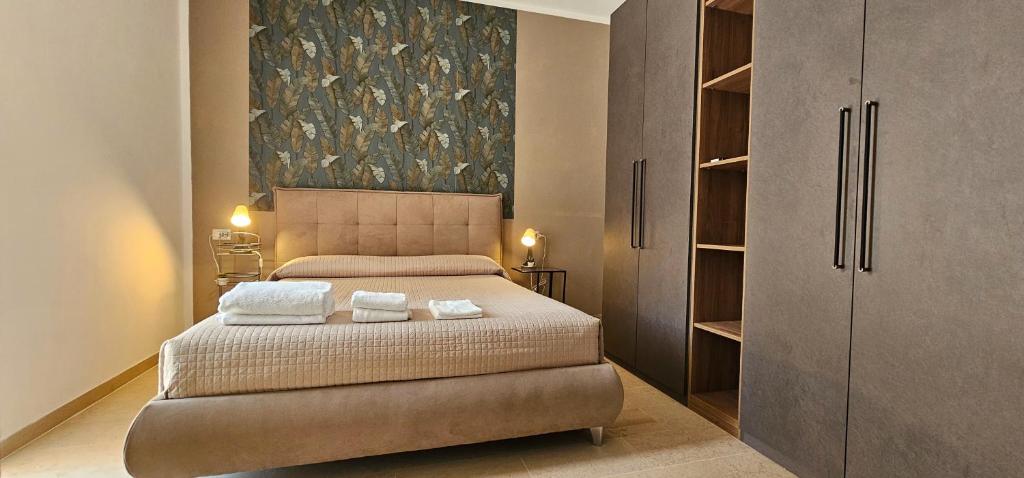 a bedroom with a bed with two towels on it at MareMy Vasto Centro in Vasto
