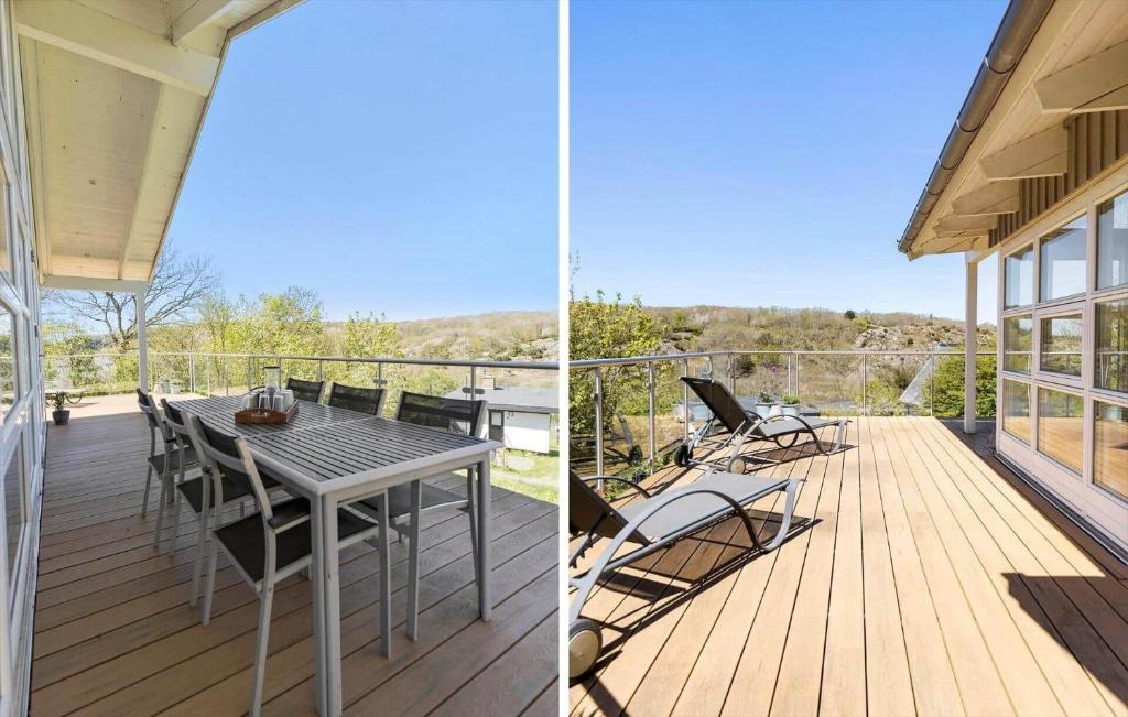 a patio with a table and chairs on a deck at 6824 Allinge - Hammervænget 4 in Allinge