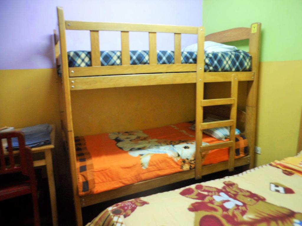 Postel nebo postele na pokoji v ubytování Hostal Jovita