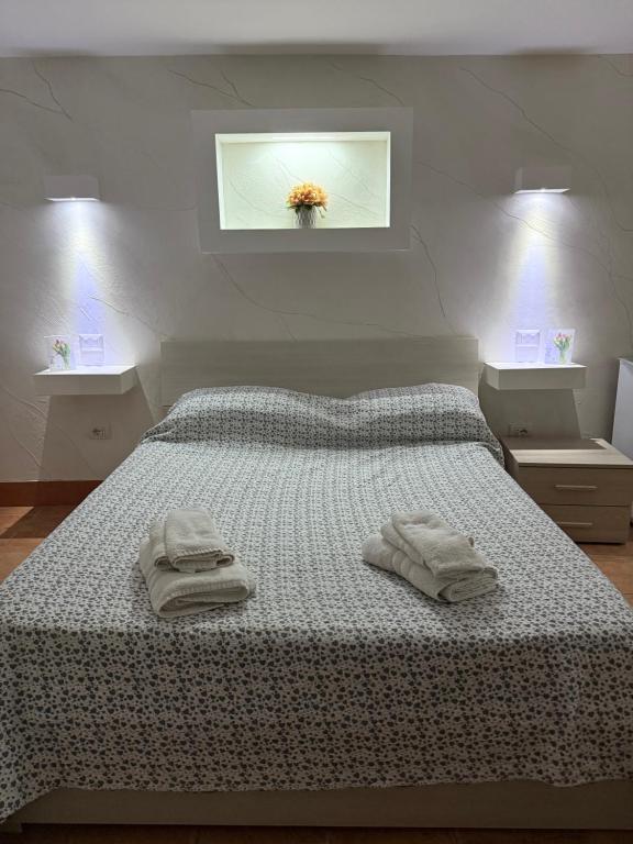 Ένα ή περισσότερα κρεβάτια σε δωμάτιο στο Ciro E Lucia