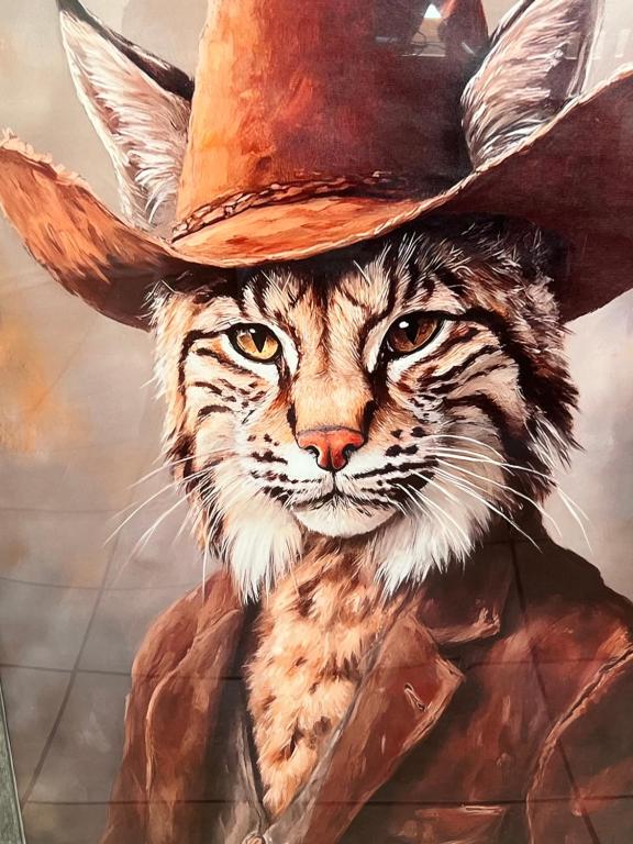 a painting of a cat wearing a cowboy hat at The Bobcat in San Marcos