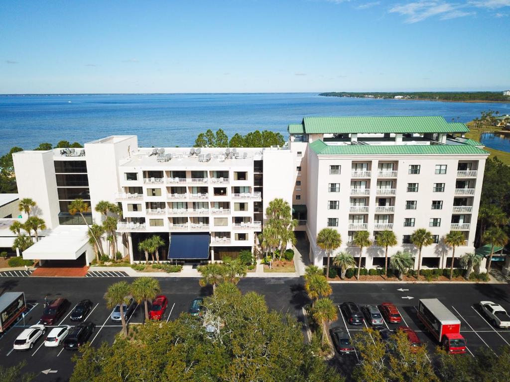 an aerial view of a hotel with a parking lot at Bay Club of Sandestin in Destin