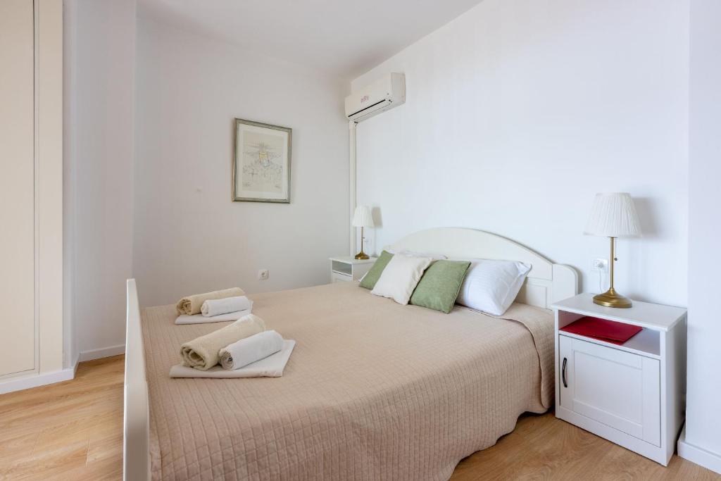 Ένα ή περισσότερα κρεβάτια σε δωμάτιο στο Apartments Neno