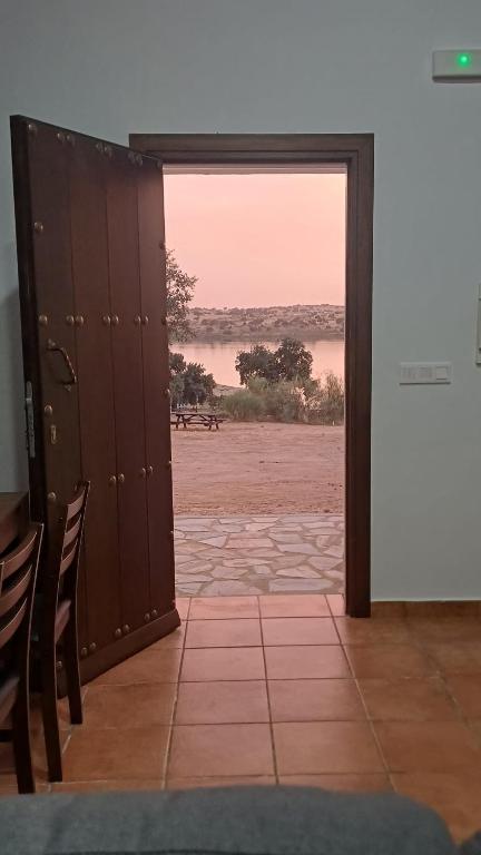 an open door with a view of the desert at Casas rurales La Colada in El Viso