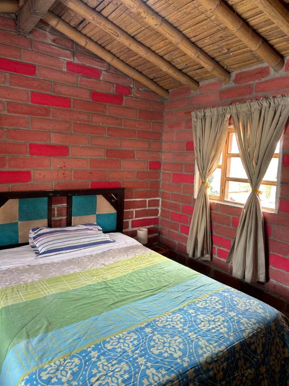 En eller flere senge i et værelse på Casa Familia Matilde