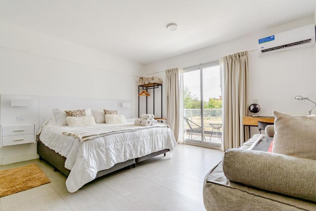 Ένα ή περισσότερα κρεβάτια σε δωμάτιο στο Departamento Aeropuerto Ezeiza