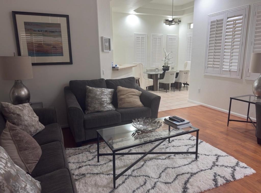 a living room with a couch and a table at TPC Golf Course North Scottsdale in Scottsdale