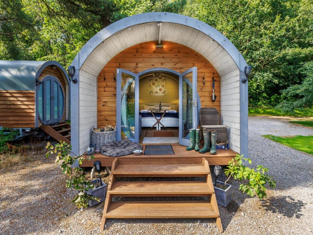 a cabin with a wooden archway with a table in it at Oak Retreat - Uk46650 in Crickhowell