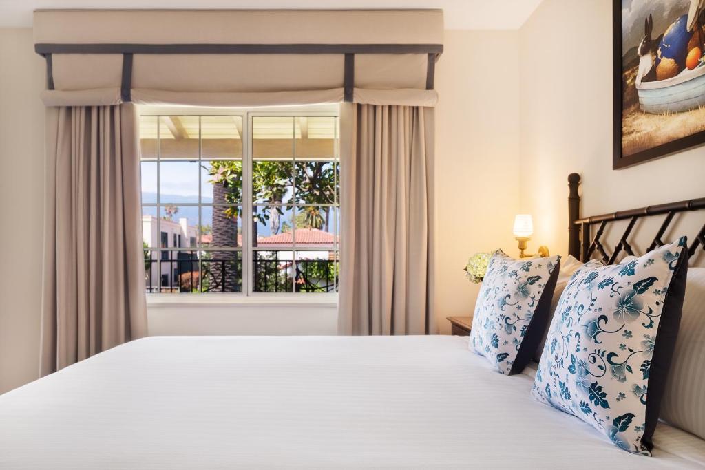 a bedroom with a bed and a window at The Milo in Santa Barbara