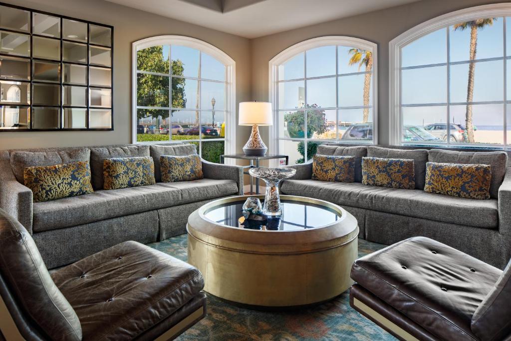 a living room with couches and a coffee table at The Milo in Santa Barbara