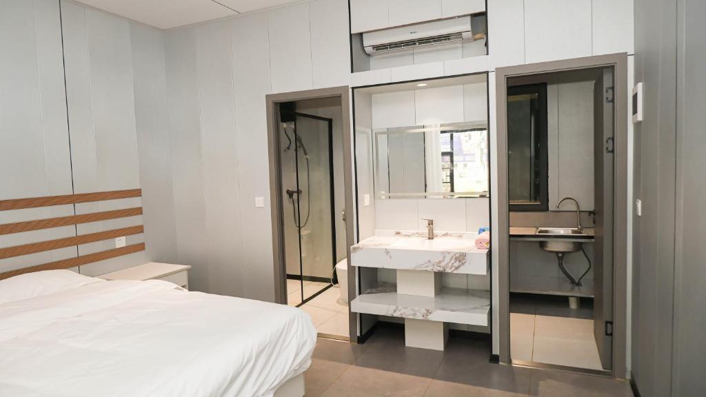 Katil atau katil-katil dalam bilik di JUNWEI HOTEl