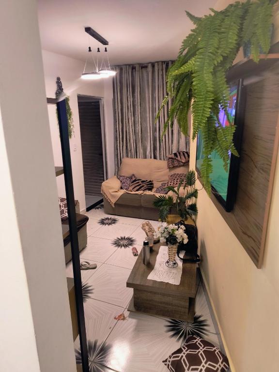 a living room with a couch and a table at Casa fb in Sao Paulo