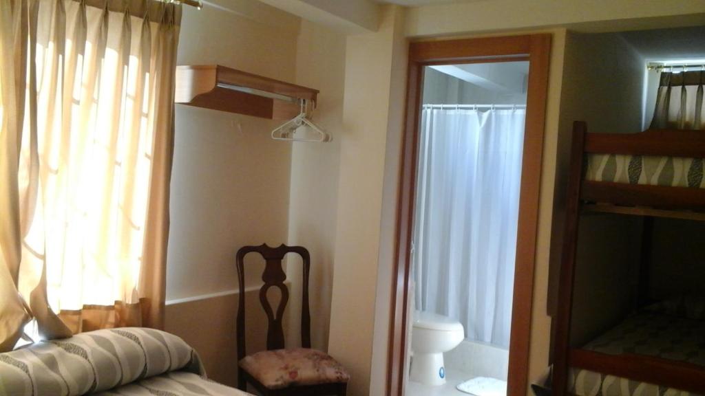 Postel nebo postele na pokoji v ubytování Hotel Mileto