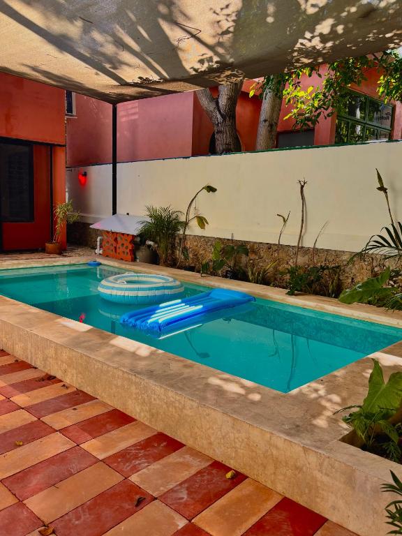 a swimming pool in a patio with at Casa Arcana Boutique in Mérida
