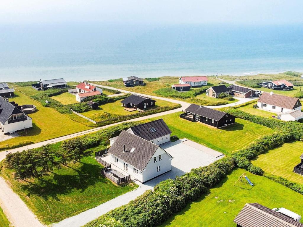 an aerial view of a home with the ocean in the background at Luxury Beach Retreat - By Traum Ferienwohnungen in Løkken