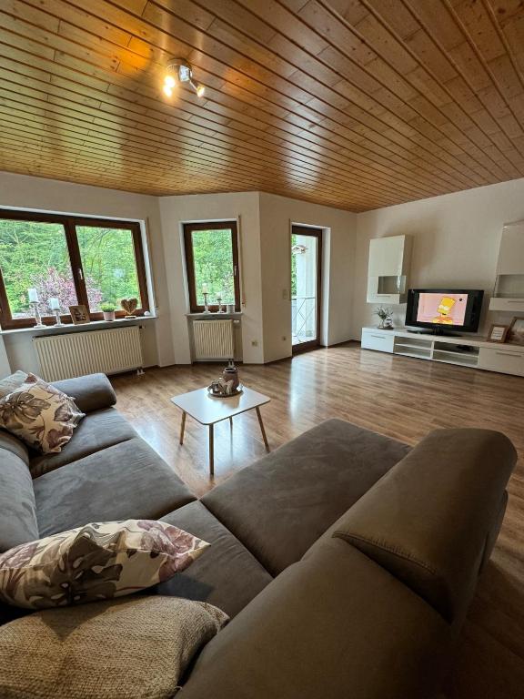 a living room with a couch and a table at Ferienwohnung Sander I Nähe Heidelberg Mannheim I 4-7 Personen in Birkenau