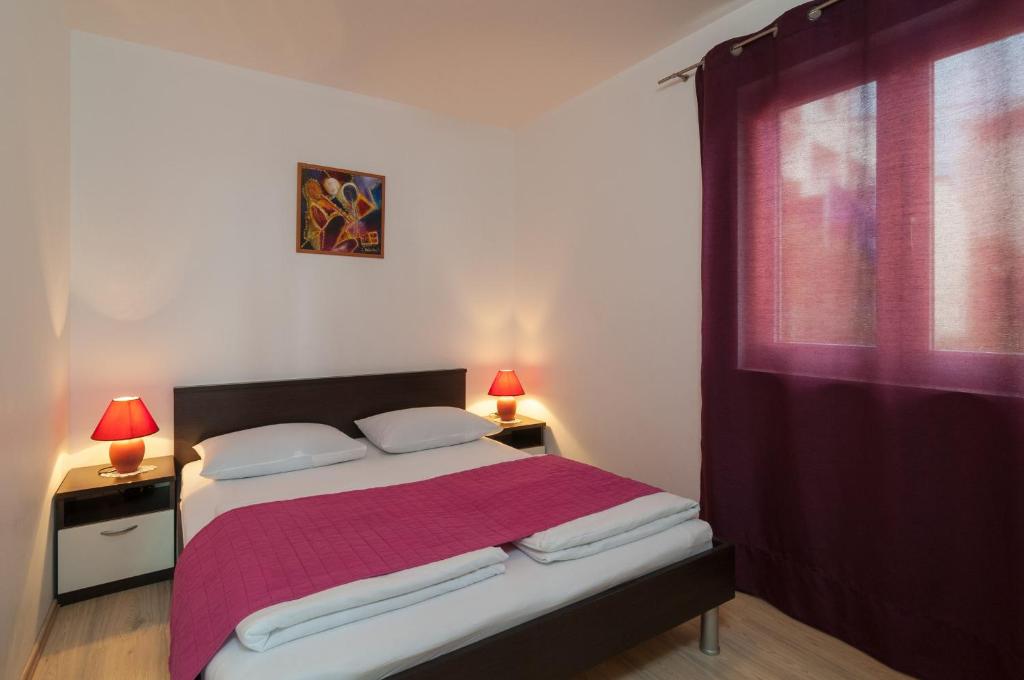 Posteľ alebo postele v izbe v ubytovaní Apartment Božan
