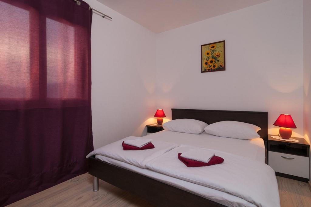 Posteľ alebo postele v izbe v ubytovaní Apartment Božan