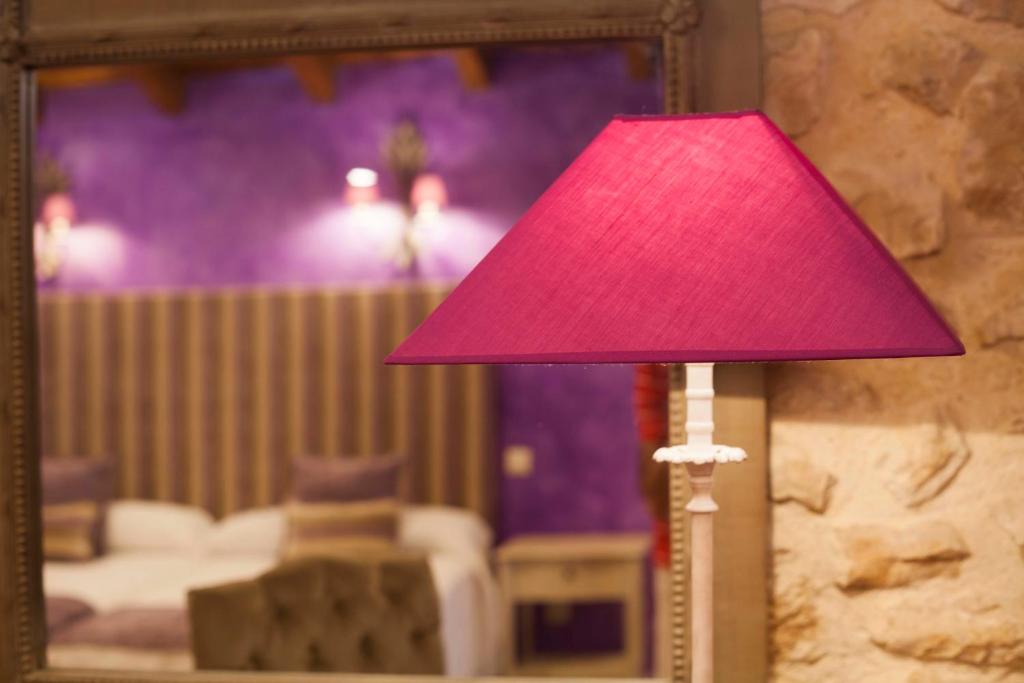 Posteľ alebo postele v izbe v ubytovaní Hotel Rural La Torre de Bisjueces