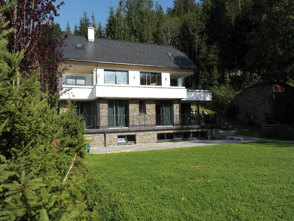 a house with a large yard in front of it at Chalet in Mauterndorf near Ski Lift in Mauterndorf
