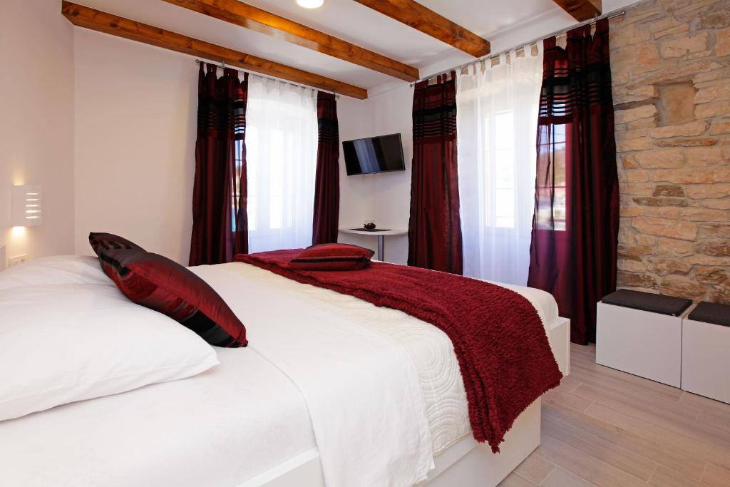 Postel nebo postele na pokoji v ubytování Luxory D-Rooms