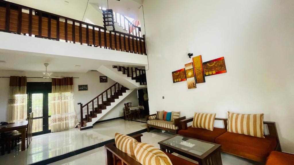 a living room with a couch and a table at Cozy 3-Bedroom Retreat Near Colombo Maharagama in Maharagama