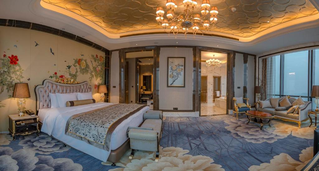 Säng eller sängar i ett rum på Wanda Vista Zhengzhou