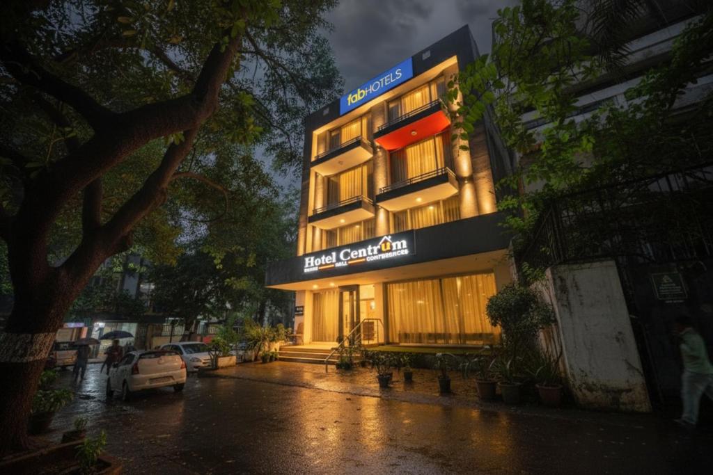 a building with a sign on the side of it at FabExpress La Serene NFC in New Delhi
