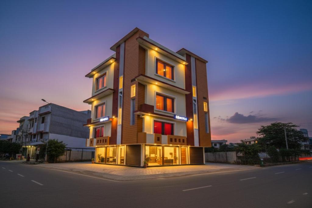 a tall building on the side of a street at FabHotel Geeta Bhawan in Ayodhya