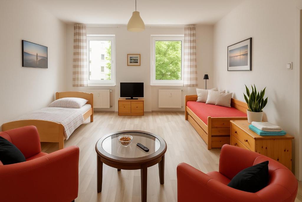 Μια τηλεόραση ή/και κέντρο ψυχαγωγίας στο Private Room in 2 rooms flat, 15mins direct U-Bahn to Hbf